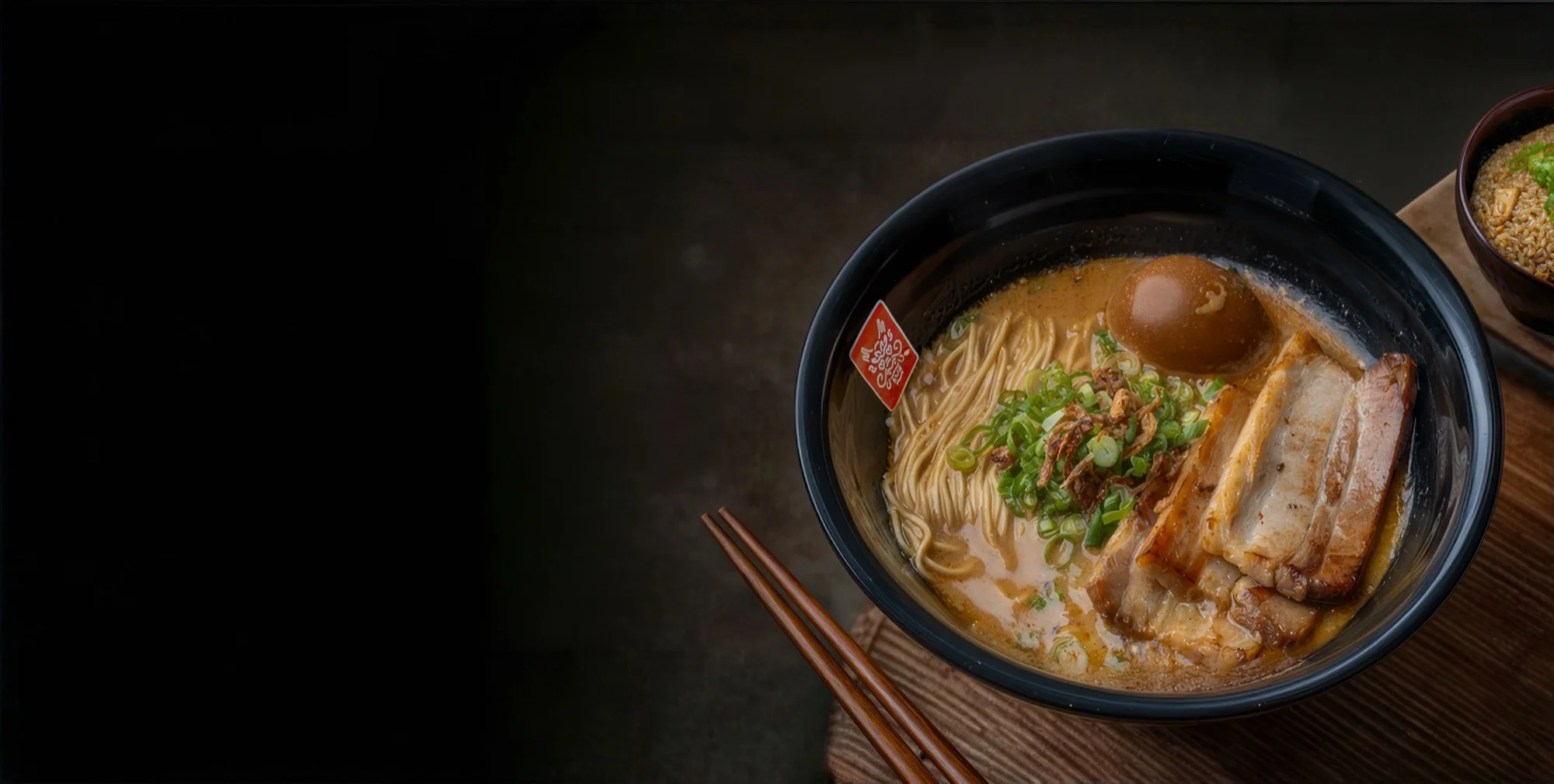 Tatsu Ramen signature bowl with rich broth, chashu pork, and fresh toppings
